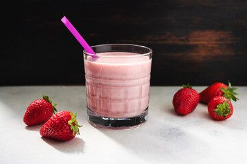 Strawberry smoothie drink, blended cocktail, milkshake in a glass