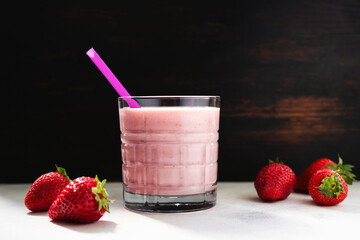 Strawberry smoothie drink, blended cocktail, milkshake in a glass