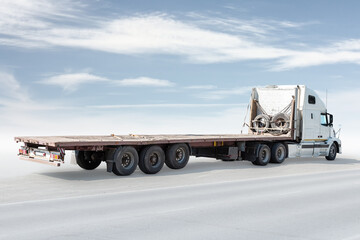 White long distance bonnet truck with a semitrailer isolated on bright background with sky