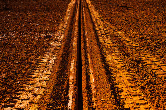 A long trench in a clay dirt racing track