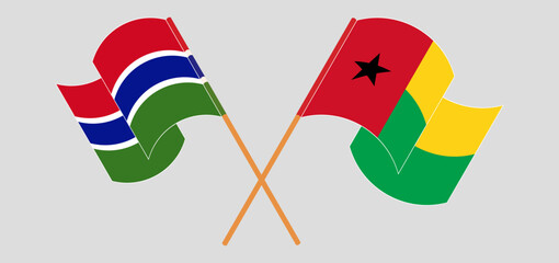 Crossed and waving flags of the Gambia and Guinea-Bissau