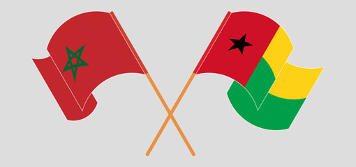 Crossed and waving flags of Morocco and Guinea-Bissau