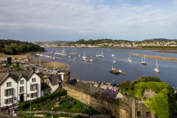 The Sailboats in the Harbour in the Conwy Estuary on a sunny afternoon in in the mediaeval Town of...