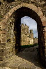 Gateway along the walls of medieval castle ruins © Marieke