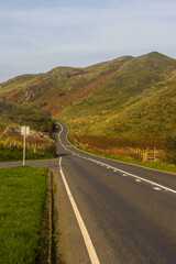 Road winding through a mountain pass in the southern area of Erei National Park in Wales