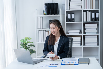 The Asian female business professional displayed a cheerful expression in her office.