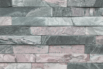 Stone cladding wall detail, background.