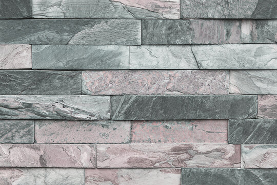 Stone cladding wall detail, background.