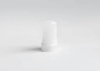 mineral alum crystal stick, natural organic deodorant on white background