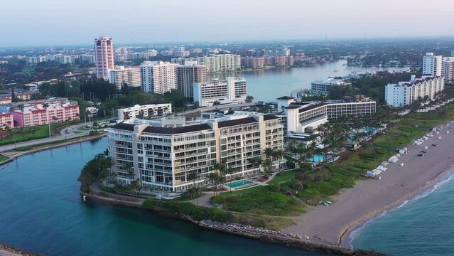 Forward moving aerial view of Boca Raton skyline from the sea early morning. 