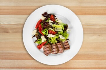 Barbecue grilled beef meat on a plate.