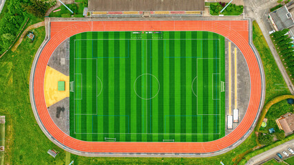 Aerial view of stadium with running tracks. Green fields for football, sports competitions
