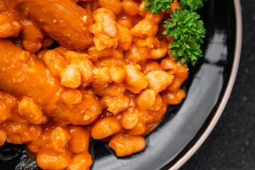 bean sausage meat tomato sauce fresh meal food snack on the table copy space food background rustic top view