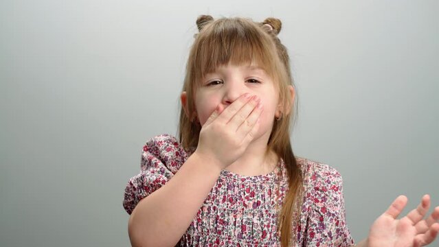 Background video of children's emotions, a portrait of a girl giving air kisses. Happiness smiles love in childhood. High quality 4k footage
