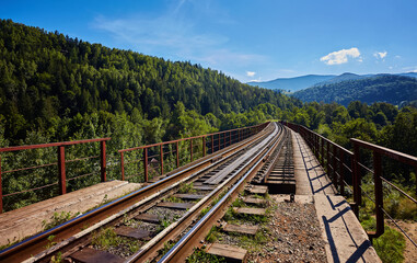 View on railway bridge above the Prut river. Beauteful autumn in Carpathian mountains, Ukraine