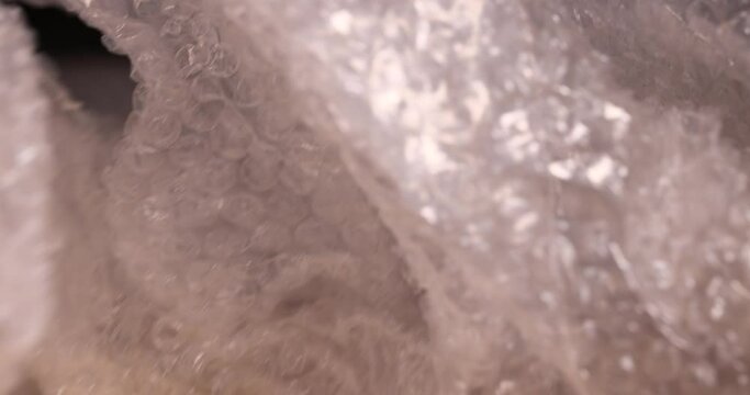 old air cellophane with a lot of bubbles for safe storage of things, close-up of a protective film with air bubbles