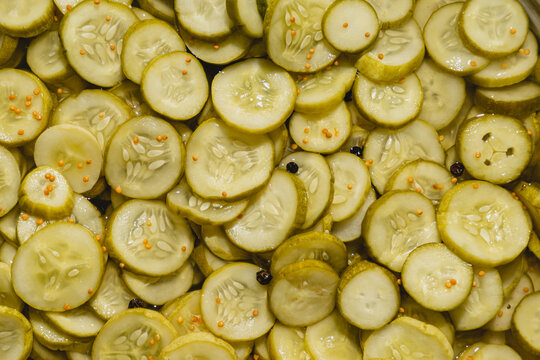 bread and butter dill pickle chips, with mustard seed and black papper, background