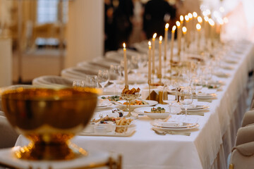 wedding luxury table setting crystal wine glass and gold forks and knives. Catering banquet. table decor for celebration anniversary, christmas, new year. table settin grestaurant.
