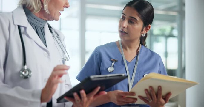 Insurance, medical or tablet with doctor and nurse in hospital for diagnosis, discussion or results. Documents, healthcare and technology with mature woman talking to medicine intern at clinic