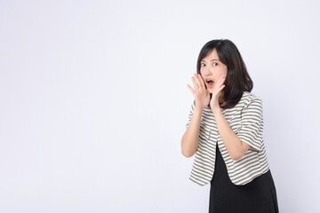 Fototapeta premium Asian woman is posing with a shouting gesture against a white background.
