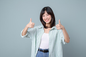 Very good. Smiling asian enterpriser woman showing okay with satisfied face expression, praise and...