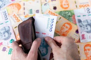 The Argentine Peso, money from Argentina. Bills of 10000, 100, 200, 500, 1000 and 2000 argentinean...