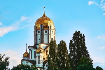 Christian cathedral with golden domes and blue clear sky