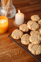 homemade peanut cookies on a wire rack on a wooden table