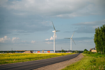 Wind turbines, technology with nature, emphasizing renewable energy.