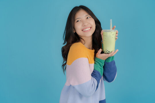 Young woman enjoying bubble tea