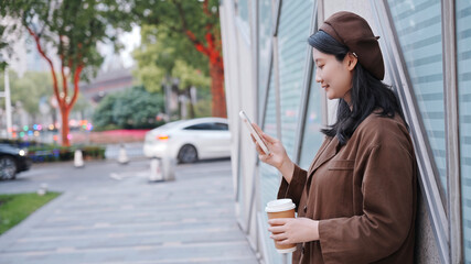 Stylish Woman Enjoying Coffee Break With Smartphone