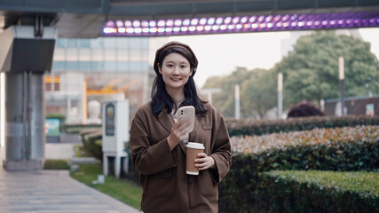 Contemporary Urban Woman Enjoying Coffee and Smartphone