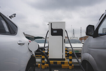 Electric Vehicles Charging at a Station on a Cloudy Day