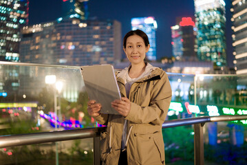 Confident Businesswoman Working Late in the City