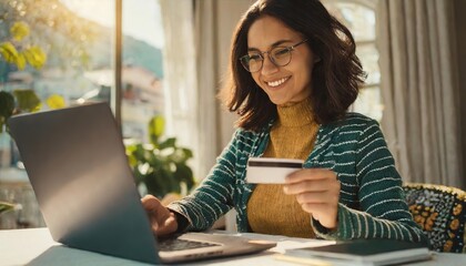 Happy young woman holding credit card and using laptop making payment online. Shopping, e-commerce, internet banking, spending money, working from home concept