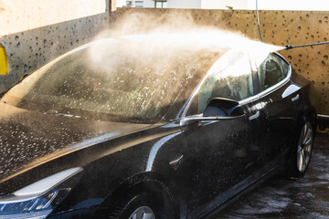 Car washing series : Cleaning car with high pressure water and foam