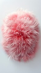 Pink fluffy ball of fur on a white surface