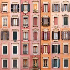 Obraz premium Colorful facade with multiple windows and shutters in a Mediterranean architectural style, showcasing urban housing aesthetics.