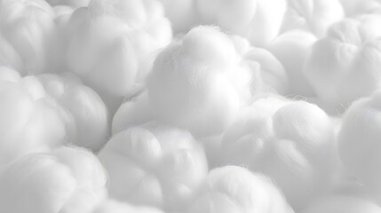 White cotton balls piled together in a stack