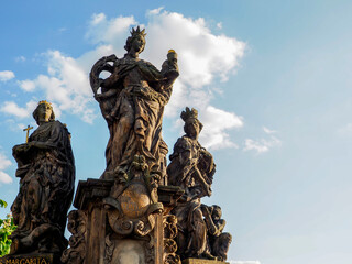 The statue of Saints Barbara, Margaret and Elizabeth are outdoor sculptures by Ferdinand Brokow,...
