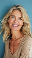 Skincare, woman, and portrait in beauty, dermatology, and wellness studio on blue background. Botox transformation, happy mature female model, facial and smile for aesthetic radiance