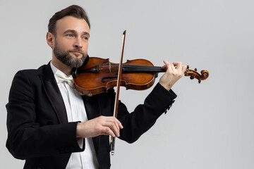 Man classic violinist at musical elegant performance