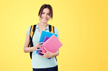 Young student with backpack bag on color background