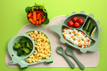 Kids Meal Art. Colorful childrens meals in animal-shaped dishes. Features pasta, broccoli,...