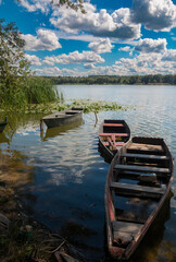 Old fishing boats moored near the shore of the Southern Bug River.