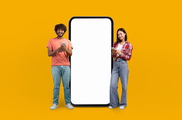 The vibrant yellow background highlights the smiling multiethnic young adults as they gesture...