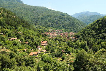On the hiking trail between Asen's, Asens Fortress and the Bachkovo Monastery, arriving in the village of Bachkovo, first view, near Plovdiv, Bulgaria
