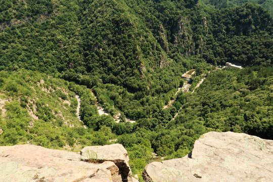 Spectacular view from the hiking trail between Asen's Fortress and the Bachkovo Monastery down onto the gorge of the Chepelare river, a power plant, dam can be seen, near Plovdiv, Bulgaria