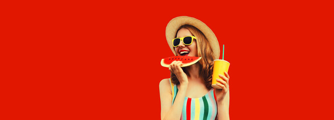 Summer happy young woman eating fresh juicy slice of watermelon with cup of juice on red background