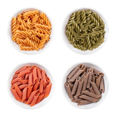 Fusilli and penne, gluten-free pasta, noodles made without wheat flour, in white bowls. Above yellow chickpea fusilli and green pea fusilli, below red lentil penne and brown buckwheat penne.